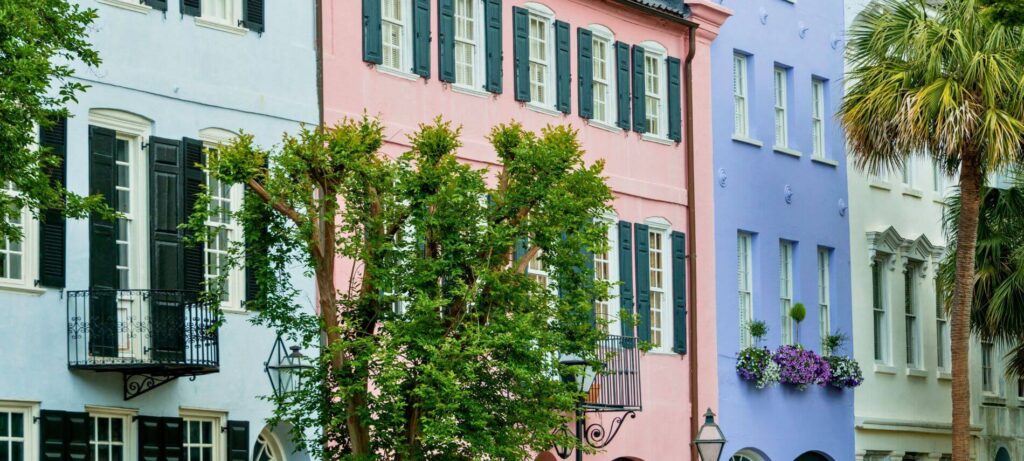 Rainbow Row in Charleston with historic homes, pastel shades with shutters, and balconies